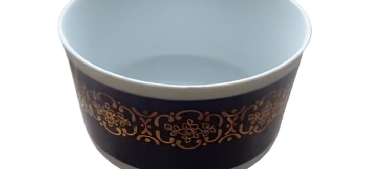 A cobalt blue porcelain bowl with intricate gold patterns by Colditz GDR.