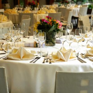 A beautifully arranged German dining table with white tablecloth, elegant glassware, and neatly placed cutlery.