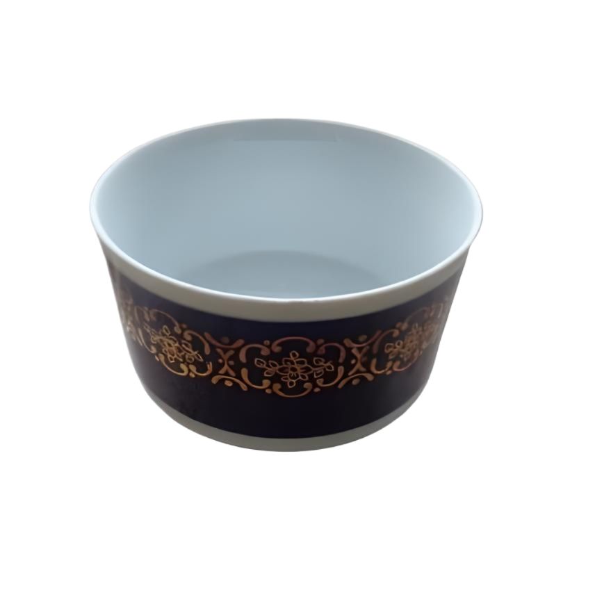 A cobalt blue porcelain bowl with intricate gold patterns by Colditz GDR.