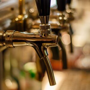 A beer tap system dispensing different types of traditional German beers.