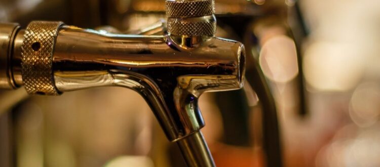 A beer tap system dispensing different types of traditional German beers.